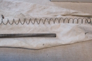 Palautinjousi ym. Remington 1100